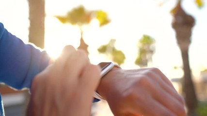 Smartwatch. Woman using smart watch. Closeup of female touching touch screen on watch, entering watch app