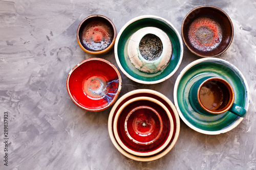 Fotografía Ceramic tableware on grey background from above