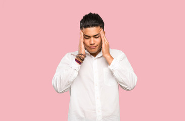 Wall Mural - Young man with headache on colorful background