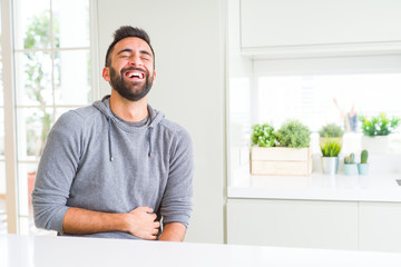 Wall Mural - Handsome man smiling cheerful with a big smile on face showing teeth, positive and happy expression