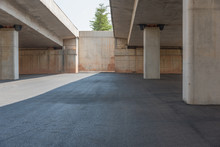 Concrete Structure And Asphalt Road Space Under The Overpass In The City