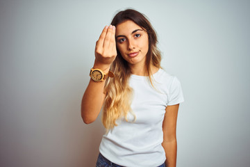 Canvas Print - Young beautiful woman wearing casual white t-shirt over isolated background Doing Italian gesture with hand and fingers confident expression