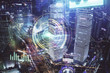 © peshkova - Data theme hologram drawing on city view with skyscrapers background multi exposure. Ai concept.