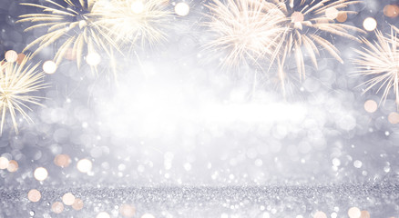 Wall Mural - new year abstract background holiday, gold and silver fireworks and bokeh, copy space.
