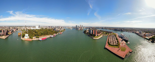 Wall Mural - High resolution aerial panorama of Rotterdam with harbour and skyline of modern residential towers, euromast and Erasmus bridge 