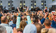 © pavel siamionov - many different people at a concert listening to rock band music open air