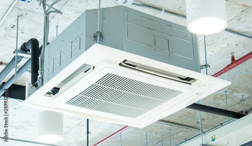 Fotomural Modern ceiling air conditioning system in loft office, cassette type