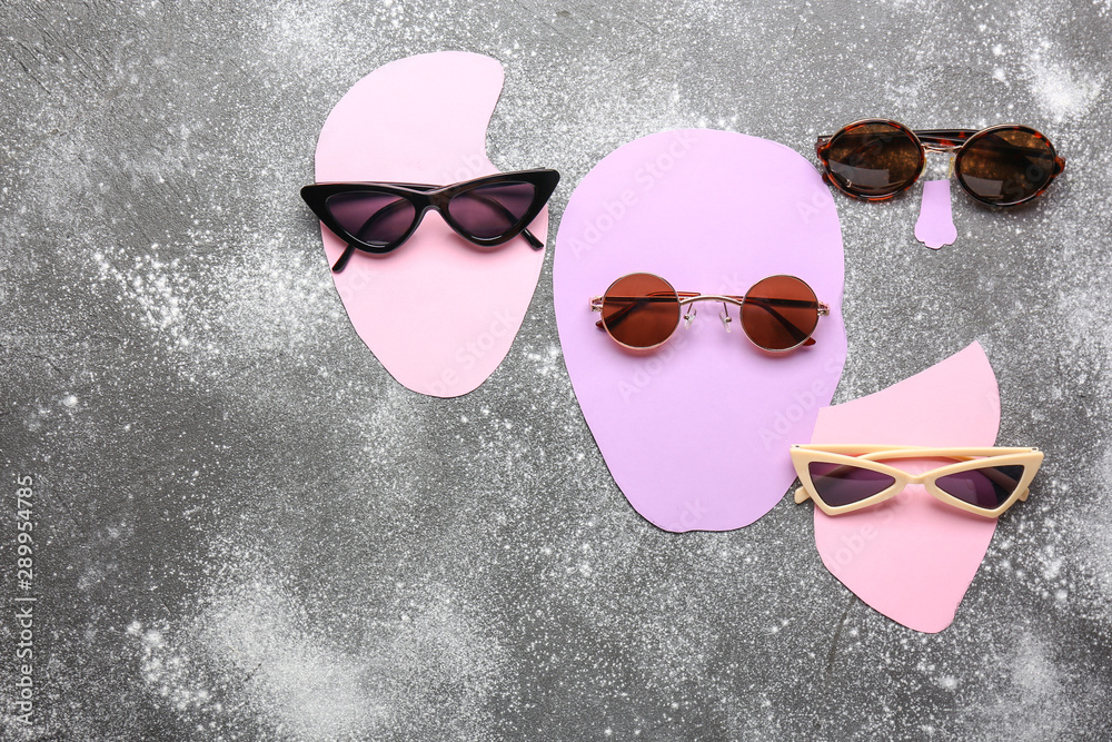 Creative composition with sunglasses on grey background