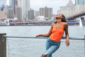 Pretty African American woman near Hudson River in New York