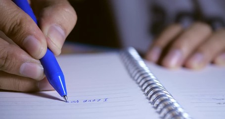 Poster - Close-up for Hand pen writing in a notebook