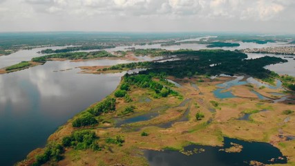 Aufkleber - drone flying above river with piece of land sky with clouds nature view