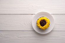 Beautiful Sunflower Decorated Chocolate Cupcake On White Wood Background