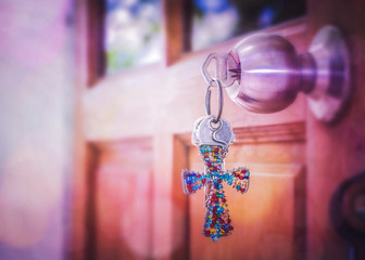 Wall Mural -  door locked with colorful Jesus cross key chain, copy space