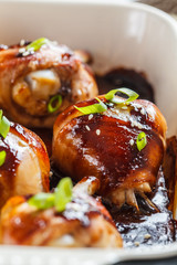 Wall Mural - Oven-baked teriyaki chicken with green onions and sesame seeds.