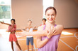 © zinkevych - Beaming PE teacher stretching body with her pupils