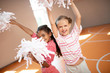 © zinkevych - Girls wearing sport clothing laughing while practicing cheerleading