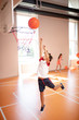© zinkevych - Boy jumping high while training and playing basketball