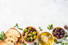 Olives, Ciabatta And Olive Oil On White Background.