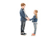 © LIGHTFIELD STUDIOS - side view of kids holding hands and looking at each other isolated on white