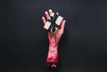 ArtificialÂ severed Hand With Packed Present
