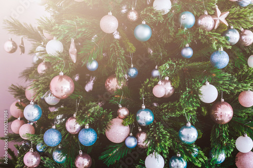 Great Beautifully Decorated Christmas Tree With Pink Baubles Ribbons Snowflakes And A Lot Of Gift Boxes And Toys Beneath Over White Brick Background Buy This Stock Photo And Explore Similar Images
