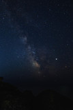 Fototapeta Kosmos - Starry sky at night on the sea coast