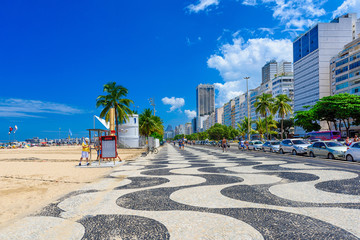 Fototapete - View of Leme beach and Copacabana with palms and mosaic of sidewalk in Rio de Janeiro, Brazil. Copacabana beach is the most famous beach in Rio de Janeiro. Sunny cityscape of Rio de Janeiro