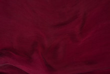 Soft Smooth Burgundy Silk Fabric Background. Fabric Texture.