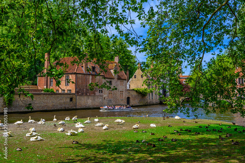 View of canal in the historic city center of Bruges (Brugge), West Flanders p...