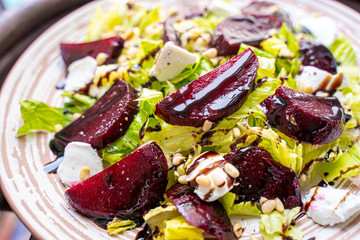 Wall Mural - Homemade Healthy Salad with Beetroot, Goat Cheese, Pine Nuts and Balsamic Cream