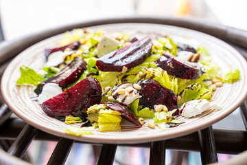 Wall Mural - Homemade Healthy Salad with Beetroot, Goat Cheese, Pine Nuts and Balsamic Cream