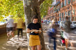 © JimBo - young woman reading in the street