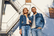 © GVS - Young beautiful woman and man in jeans cloth posing on urban architecture