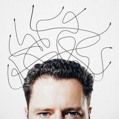 Poster - Choice of direction concept with man head and chaotic arrows above at light background.
