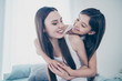 © deagreez - Close-up portrait of two nice beautiful attractive lovely charming cute cheerful cheery sweet tender kind people cuddling spending free time weekend cozy comfort light white interior room