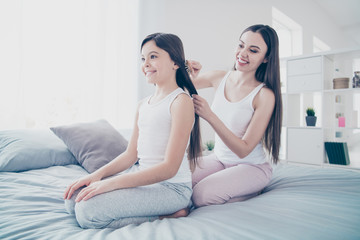 Sticker - Portrait of two nice beautiful attractive lovely charming cute tender sweet affectionate cheerful cheery careful people making straight hairstyle hairdo in light white interior room indoors