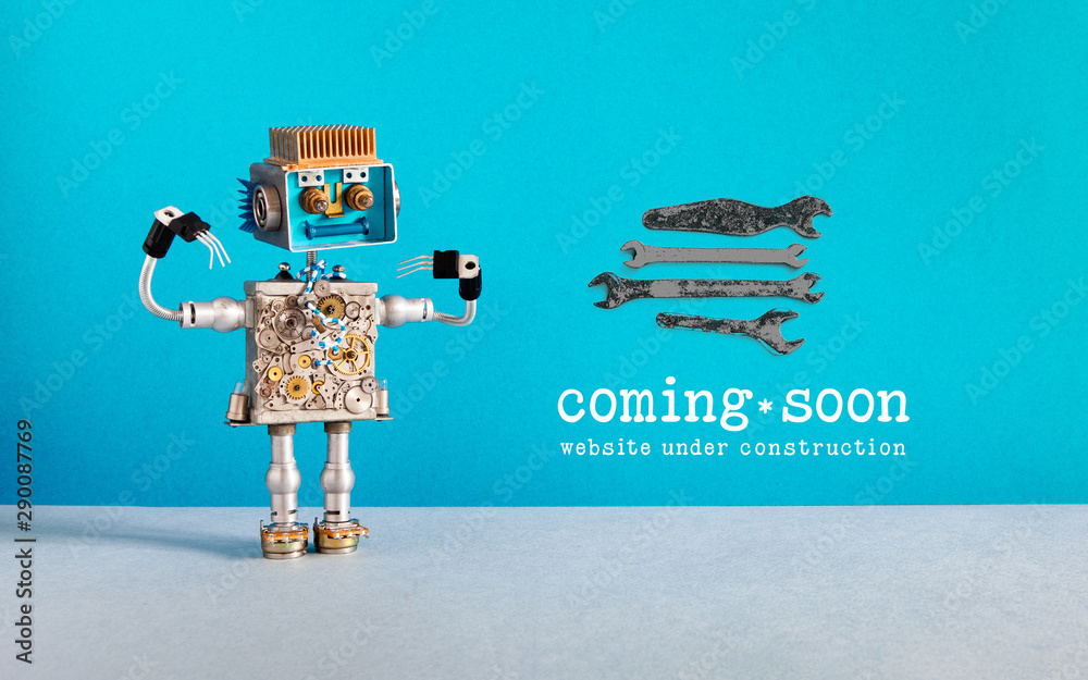 Web site under construction Coming Soon template page. Toy robot looks ...