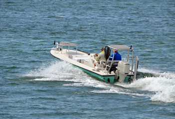 Wall Mural - Small fishing skiff off Miami Beach on the Florida Intra-Coastal Waterway