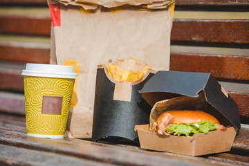 burger in box with fry potatoes coffee cup. fast food