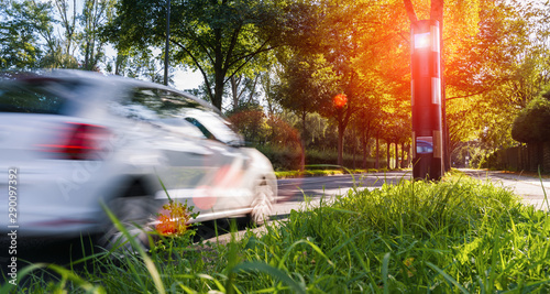 Fotomural car drives into a radar trap, safe road traffic concept image