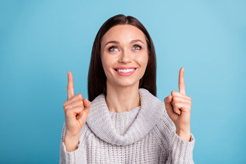 Wall Mural - Close up photo of lovely sweet freelancer entrepreneur choose ads decide novelty advise promo point index finger wear fashionable white jumper isolated over blue color background