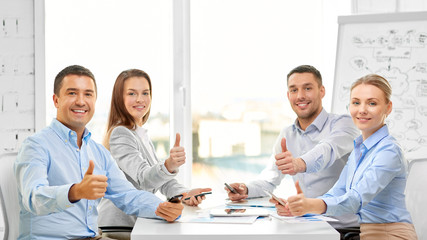 Canvas Print - business people, gesture and success concept - happy smiling creative team showing thumbs up at office