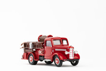Vintage Red Fire Truck Toy On White Background