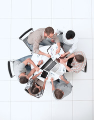 Wall Mural - top view.the business team holds a round table