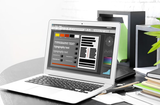 Stylish modern workplace with laptop at home