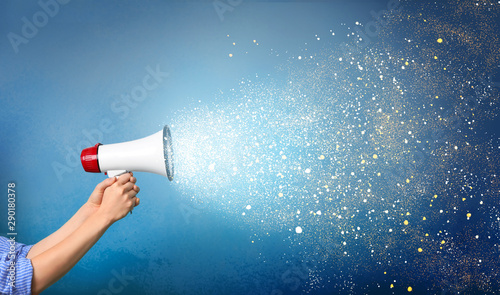 Cuadros en Lienzo Woman holding megaphone on color background