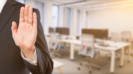 Wall Mural - Businessman gesture with his hands on background