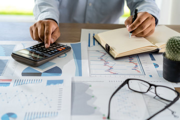 Aufkleber - businessman working using a calculator finance accounting concept achievement to balance man assistant accounting