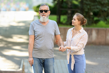 Poster - Woman helping blind mature man to cross road