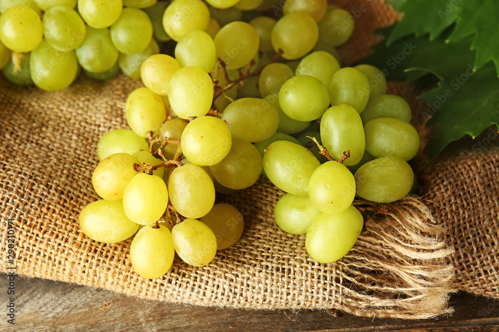 Ripe sweet grapes on table